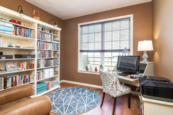 a workspace with a couch and a window