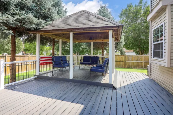 a view of a house with backyard and porch