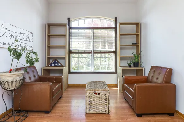 a living room with furniture and a window