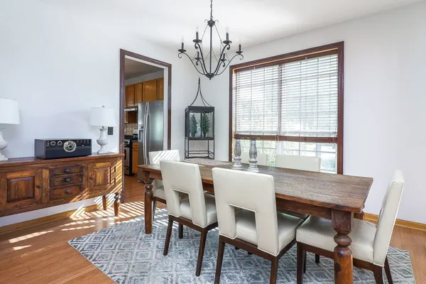 a view of a dining room with furniture window and wooden floor