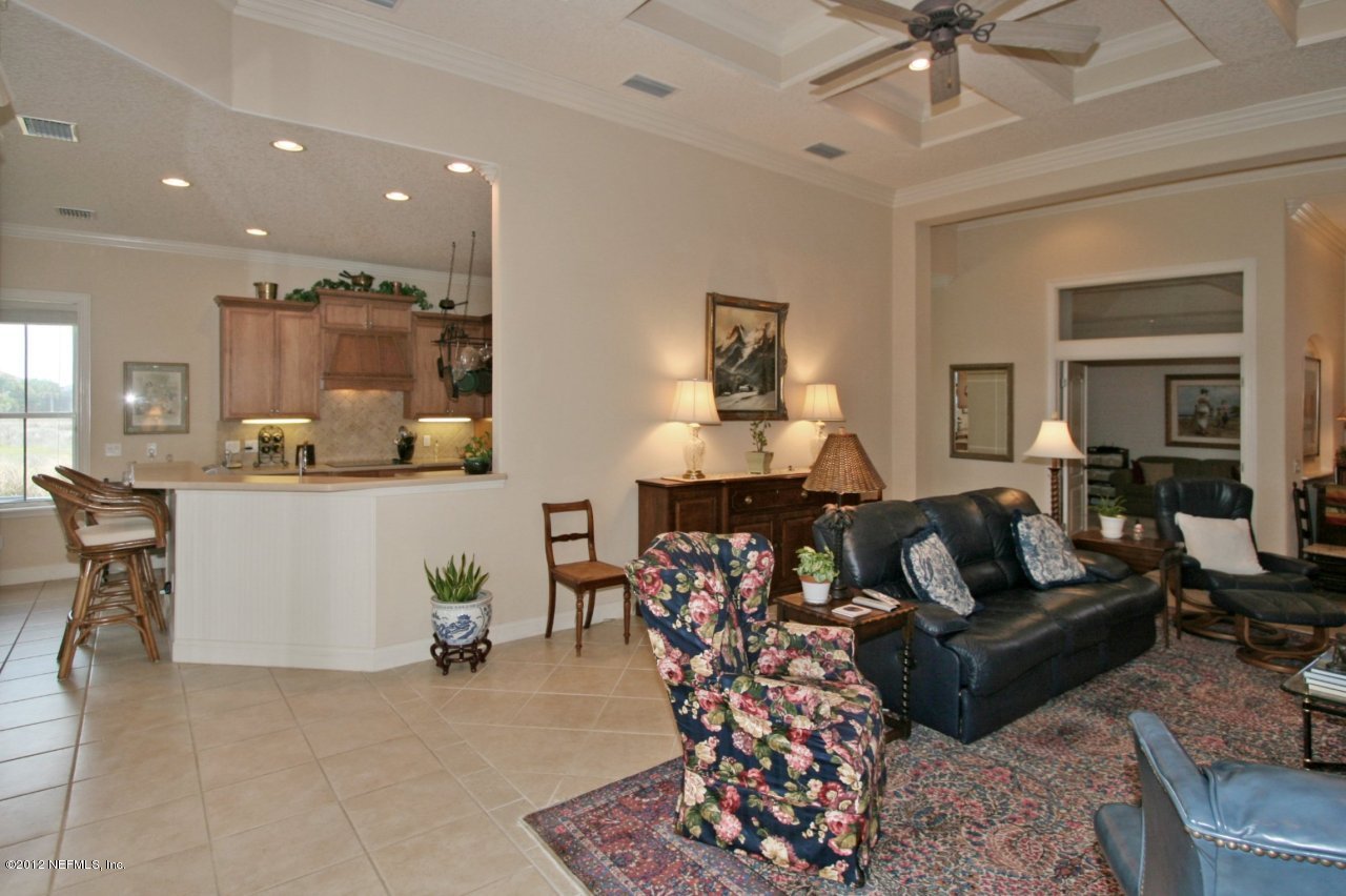 349 Fiddlers Point Drive St. Augustine, FL 32080 - Photo 11 of 27 a living room with furniture and a chandelier