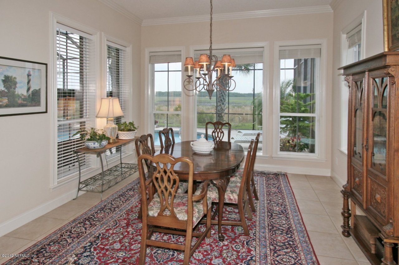 349 Fiddlers Point Drive St. Augustine, FL 32080 - Photo 12 of 27 a view of a dining room with furniture window and outside view