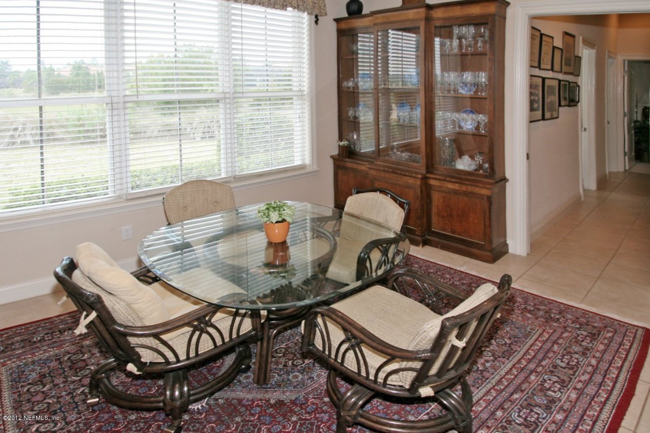 349 Fiddlers Point Drive St. Augustine, FL 32080 - Photo 16 of 27 a outdoor dining space with furniture and outdoor view