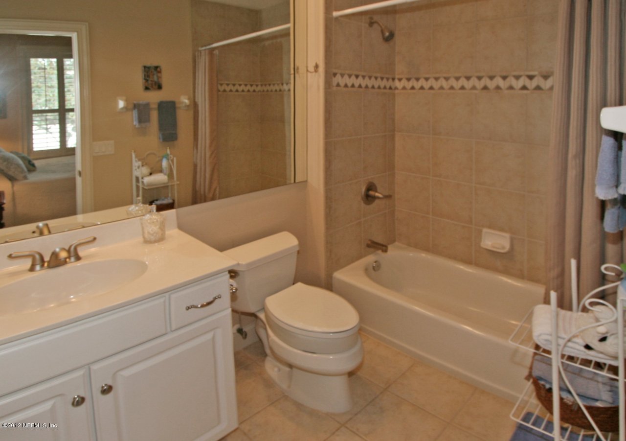 349 Fiddlers Point Drive St. Augustine, FL 32080 - Photo 22 of 27 a bathroom with a sink a toilet and a bathtub