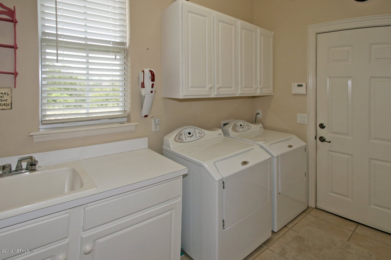 349 Fiddlers Point Drive St. Augustine, FL 32080 - Photo 24 of 27 a utility room with dryer and washer