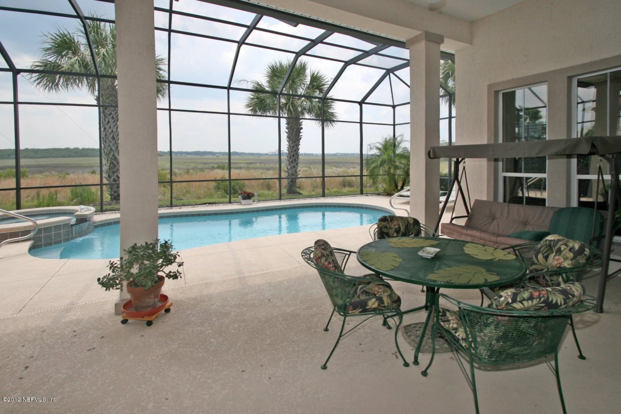 349 Fiddlers Point Drive St. Augustine, FL 32080 - Photo 26 of 27 a dining room with furniture and a large window
