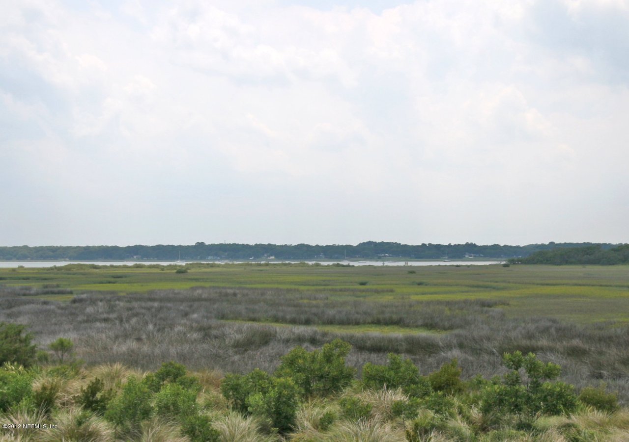 349 Fiddlers Point Drive St. Augustine, FL 32080 - Photo 4 of 27 a view of an ocean beach and mountain