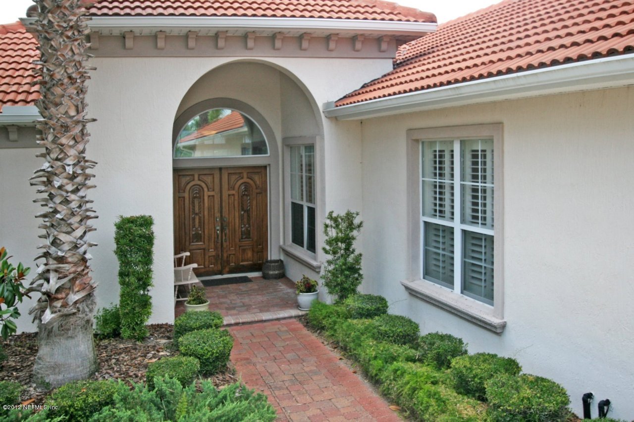 349 Fiddlers Point Drive St. Augustine, FL 32080 - Photo 7 of 27 a front view of a house with a porch