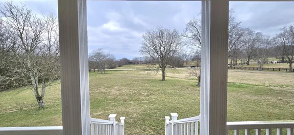 a view of a lake from a balcony