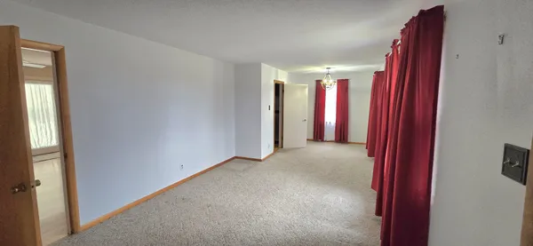 a view of a room with a windows and cabinet