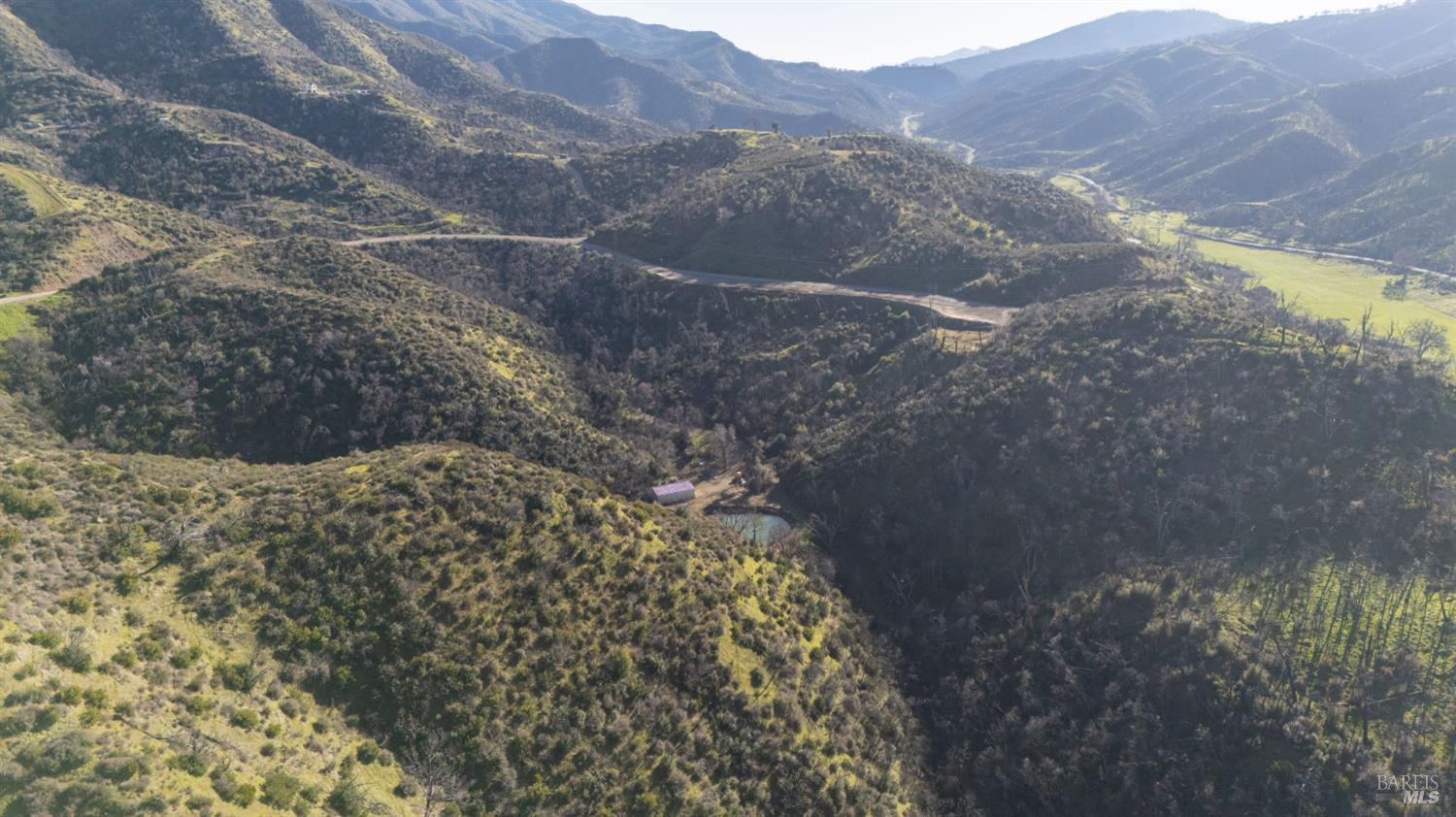 0 State Highway Napa, CA 94558 - Photo 8 of 16 a view of a dry yard with mountains in the background