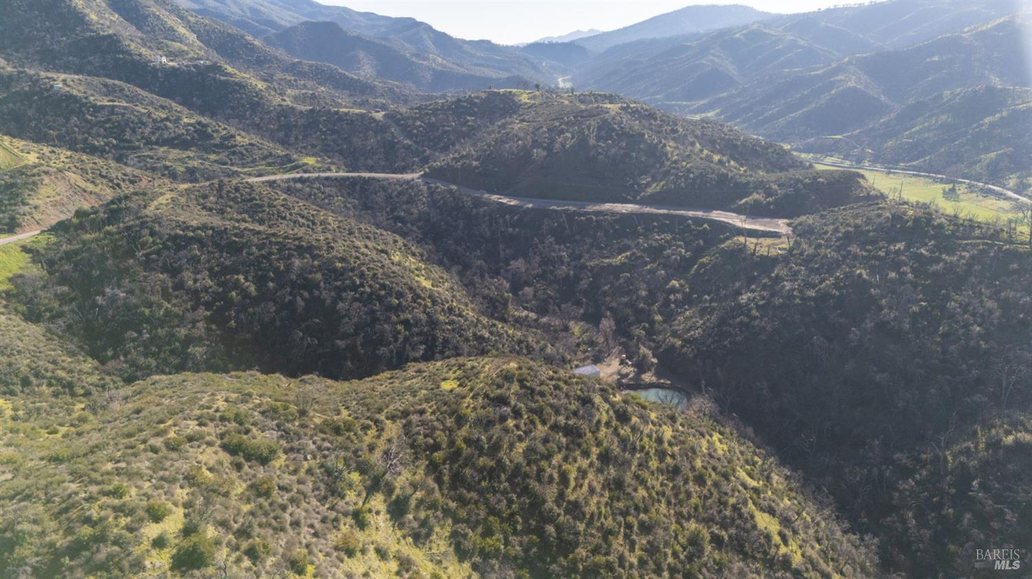 0 State Highway Napa, CA 94558 - Photo 9 of 16 a view of a dry yard with mountains in the background