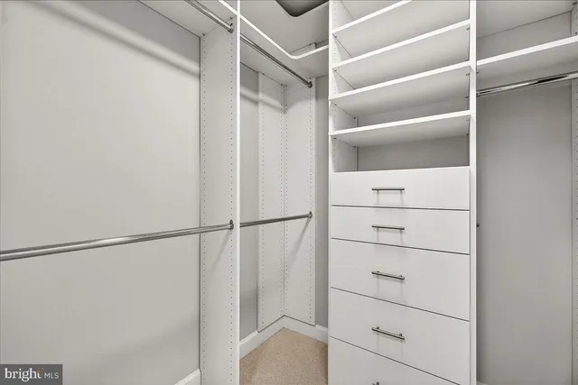 a view of an empty walk in closet