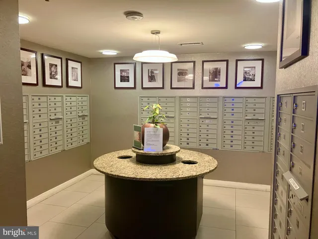 a room with pool table and windows