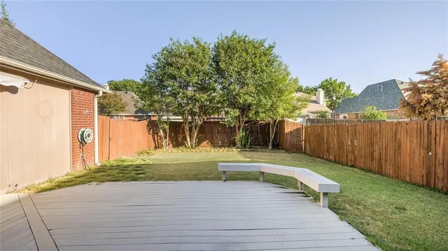 a view of a backyard of the house