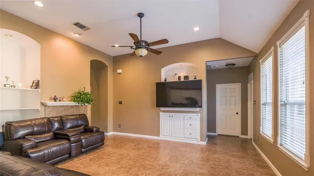 a living room with furniture and a flat screen tv