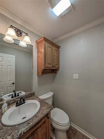 a stove top oven sitting inside of a kitchen