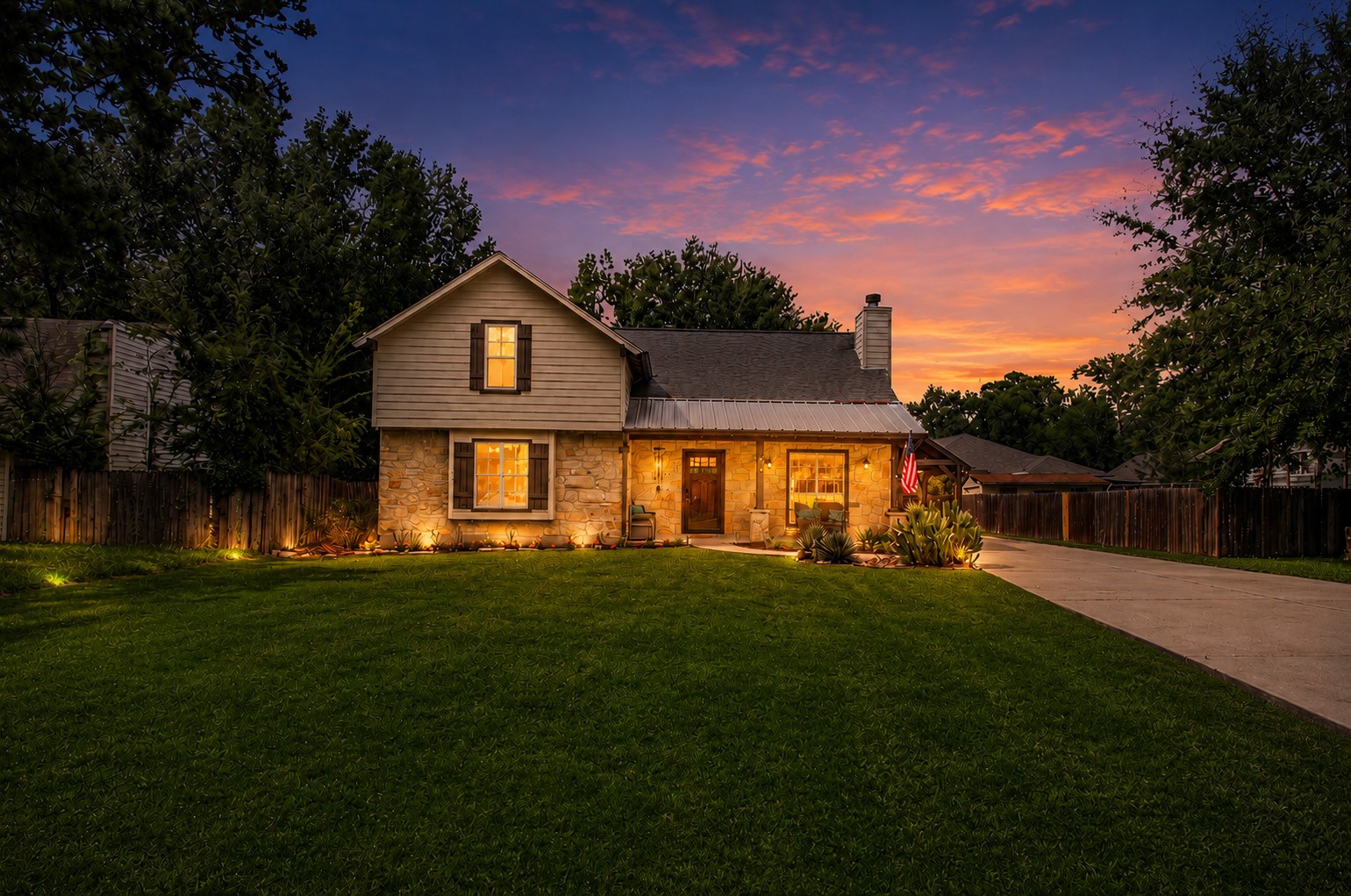 Welcome home to this charming property situated among mature trees on a spacious lot in Lake Chateau Woods.