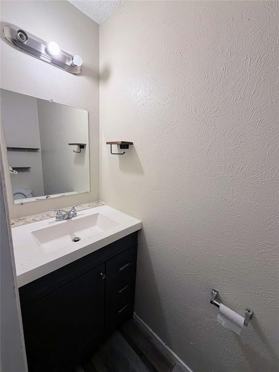 10500 Lake June Road, Unit M07 Dallas, TX 75217 - Photo 14 of 14 a bathroom with a sink and a mirror