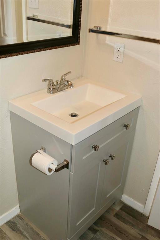 10500 Lake June Road, Unit M07 Dallas, TX 75217 - Photo 6 of 14 a bathroom with a sink and a mirror