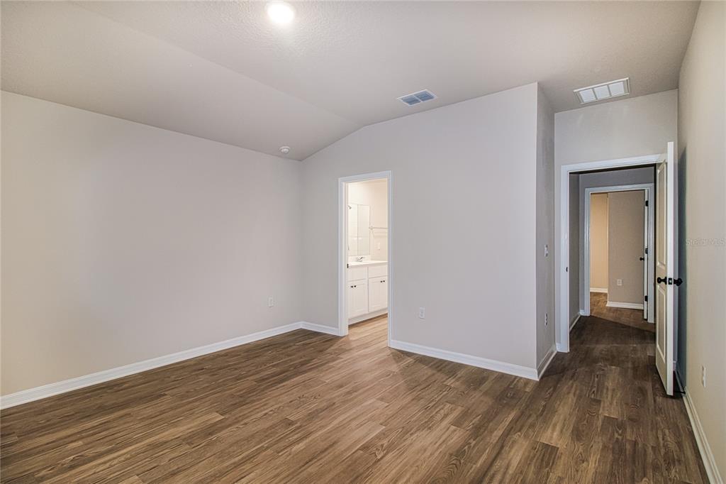 46 Ash Road Ocala, FL 34472 - Photo 10 of 20 a view of an empty room and wooden floor