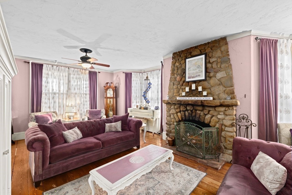 17 Old Oaken Bucket Road Scituate, MA 02066 - Photo 13 of 41 a living room with furniture and a fireplace