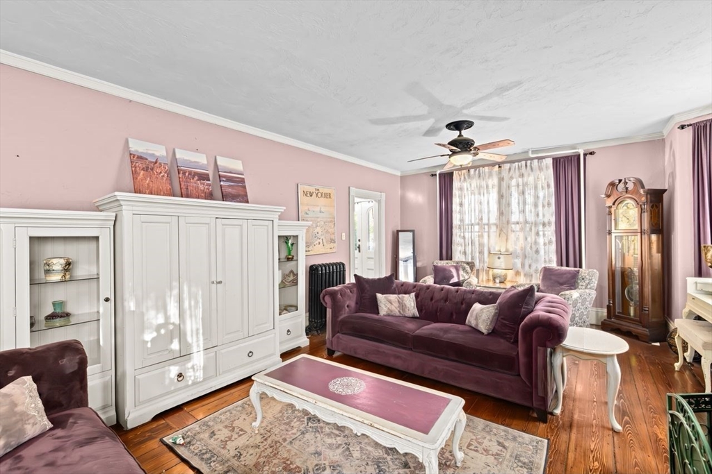 17 Old Oaken Bucket Road Scituate, MA 02066 - Photo 15 of 41 a living room with furniture and a chandelier