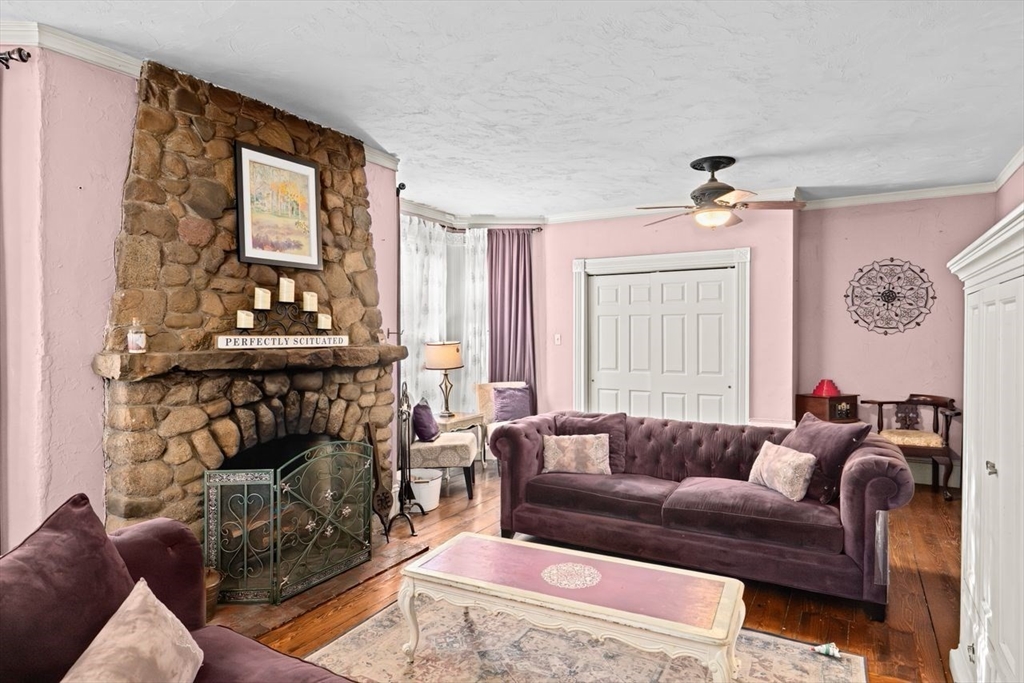 17 Old Oaken Bucket Road Scituate, MA 02066 - Photo 19 of 41 a living room with furniture a fireplace and a large mirror