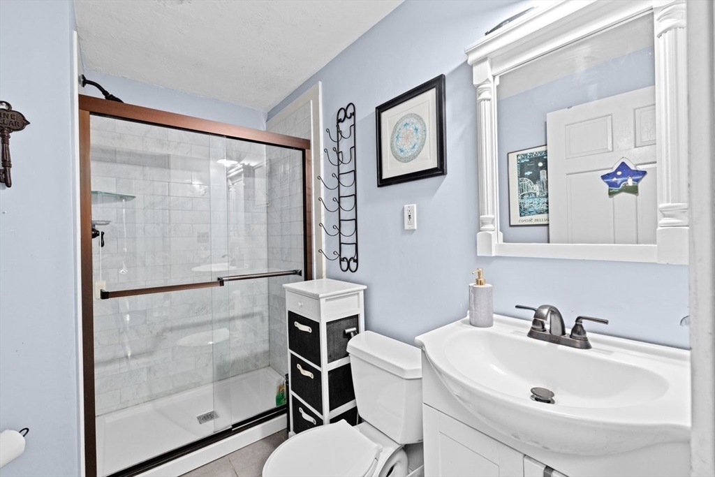 17 Old Oaken Bucket Road Scituate, MA 02066 - Photo 20 of 41 a bathroom with a sink toilet and shower