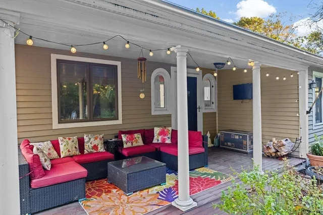 a outdoor living space with furniture and a potted plant