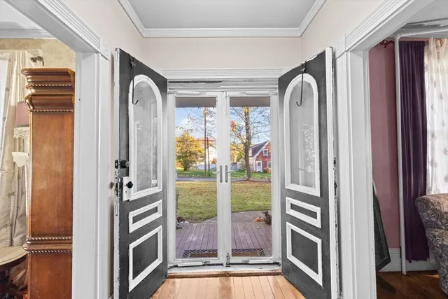 a view of a door and chair in a room