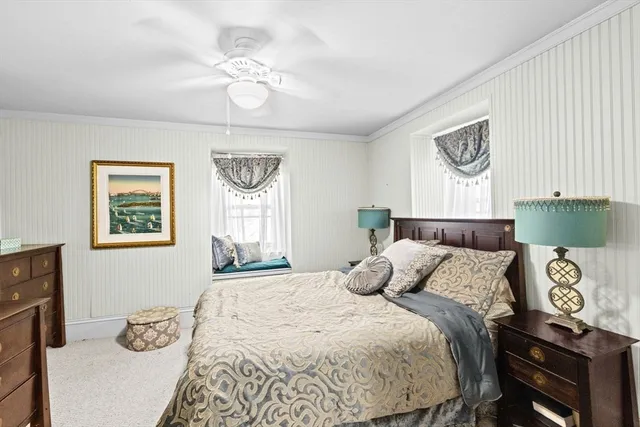 a bed room with a bed and a chandelier