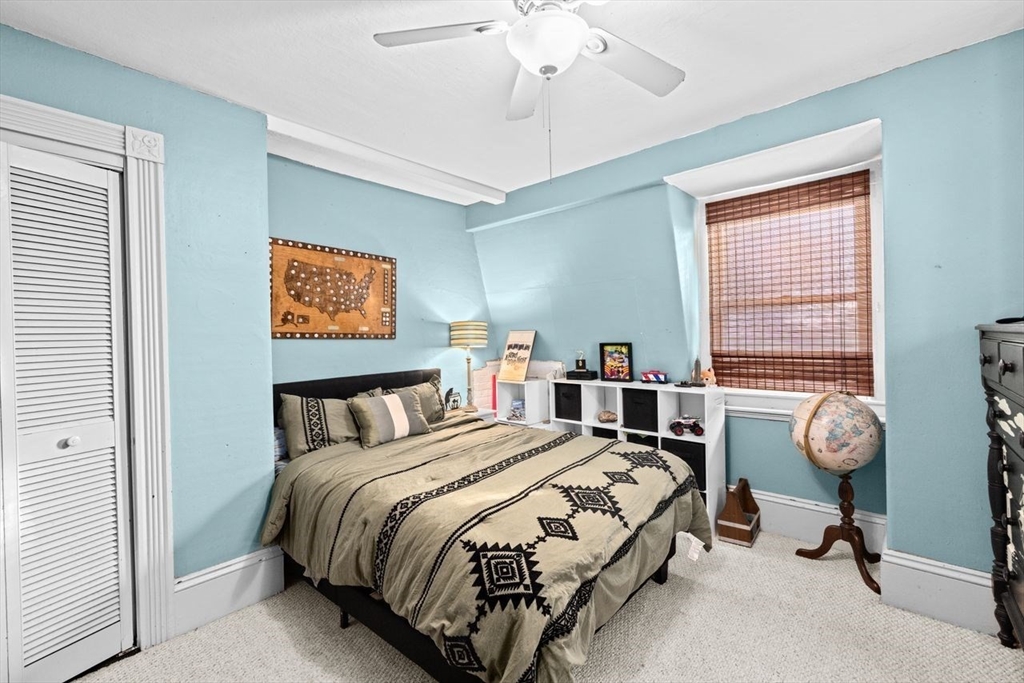 17 Old Oaken Bucket Road Scituate, MA 02066 - Photo 28 of 41 a bed room with a bed and a chandelier