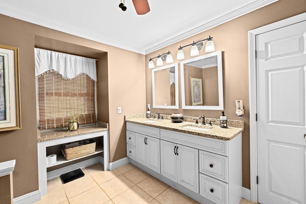 17 Old Oaken Bucket Road Scituate, MA 02066 - Photo 29 of 41 a bathroom with a double vanity sink a two mirror and a bathtub