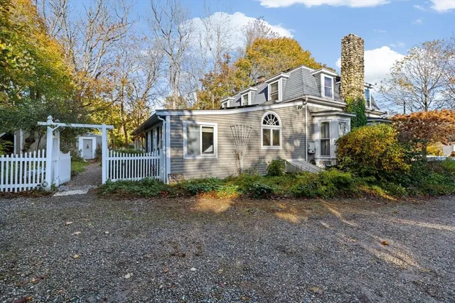 a house with trees in the background