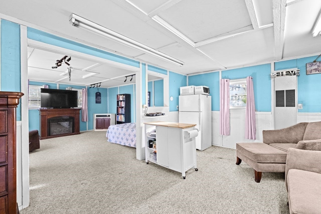 17 Old Oaken Bucket Road Scituate, MA 02066 - Photo 36 of 41 a living room with furniture and a flat screen tv