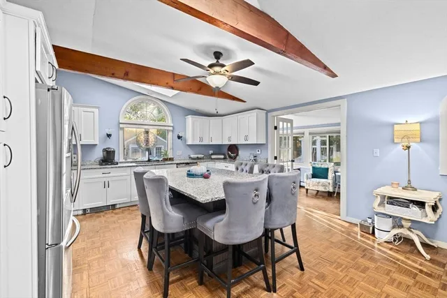 a dining room with furniture and window