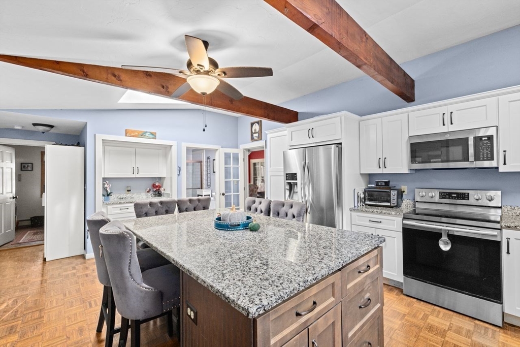 17 Old Oaken Bucket Road Scituate, MA 02066 - Photo 6 of 41 a kitchen with center island table and chairs