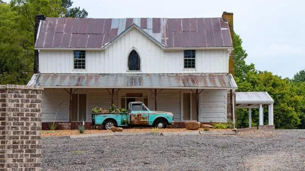 a view of a car park in front of house