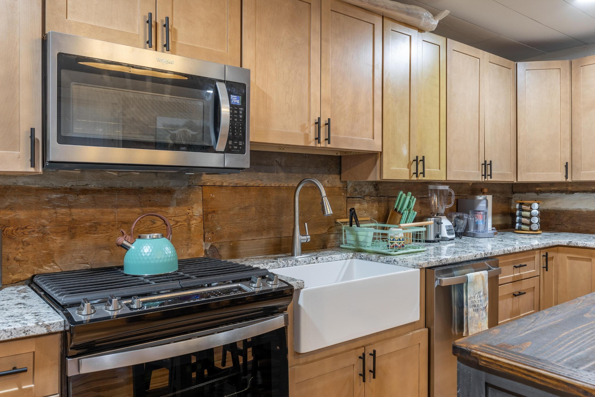 205 Us Highway Rising Fawn, GA 30738 - Photo 12 of 62 a kitchen with stainless steel appliances granite countertop a stove and a microwave