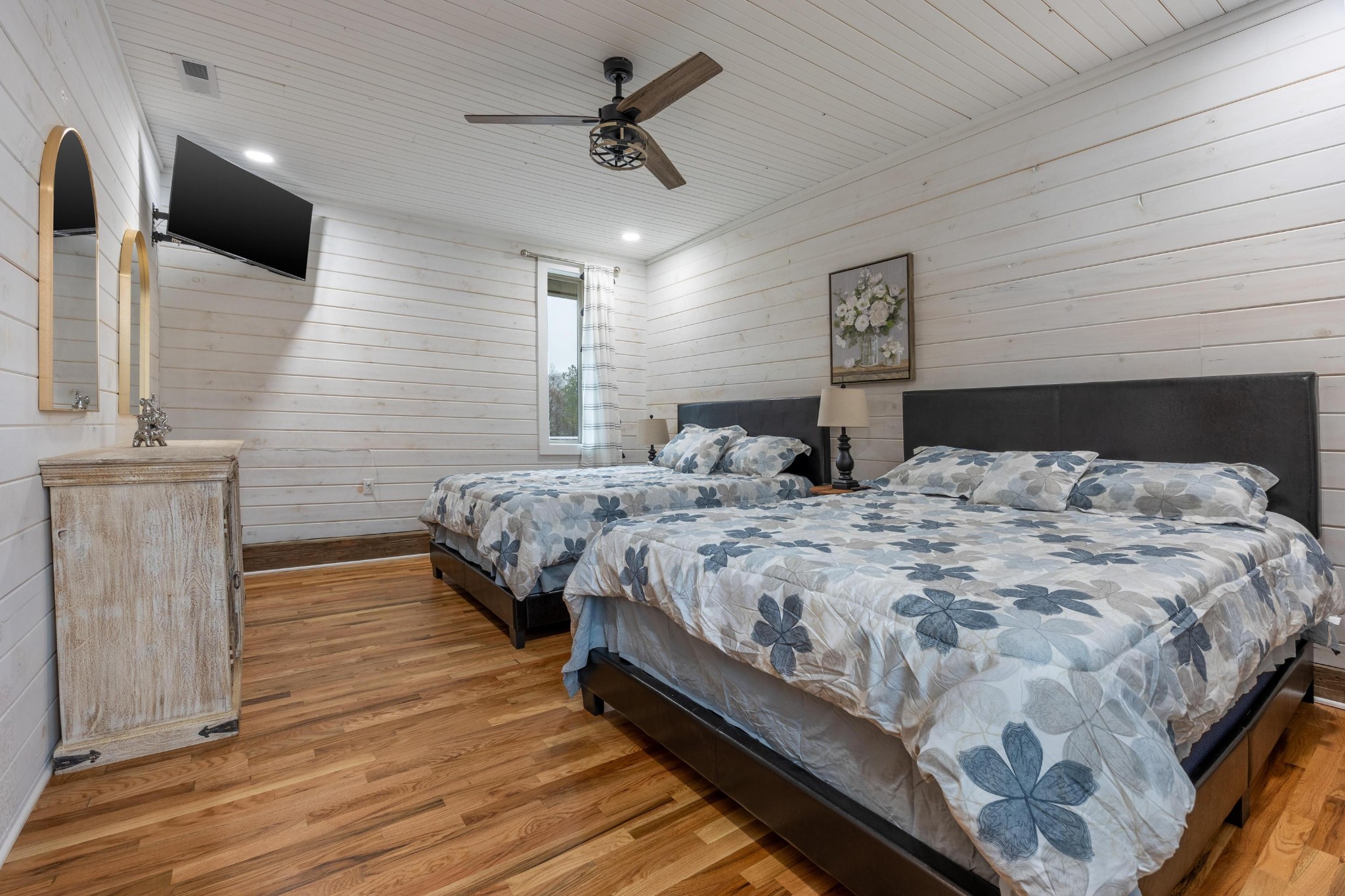 205 Us Highway Rising Fawn, GA 30738 - Photo 17 of 62 a bedroom with a bed a dresser and wooden floor
