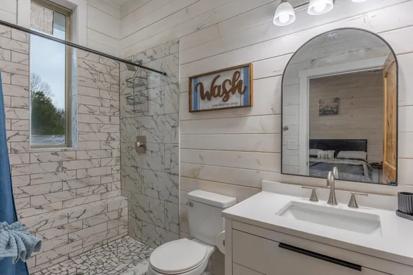 a bathroom with a double vanity sink and mirror