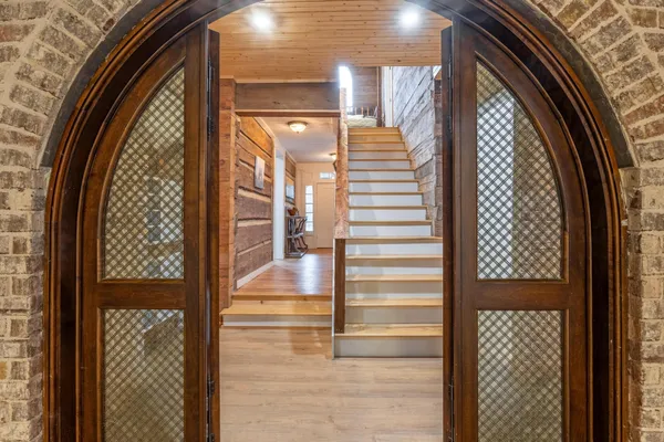 a view of entryway with wooden door