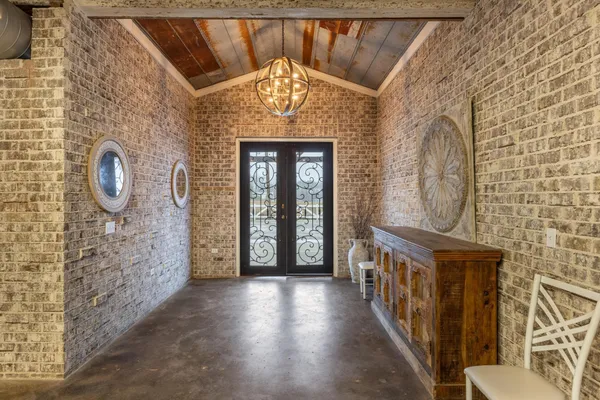 a view of a hallway with seating area