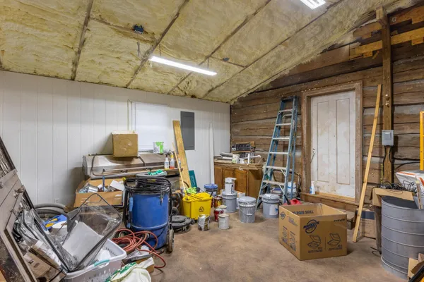 a kitchen with granite countertop a sink and cabinets