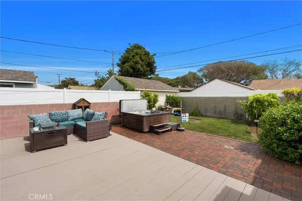 a view of a patio with couches and potted plants