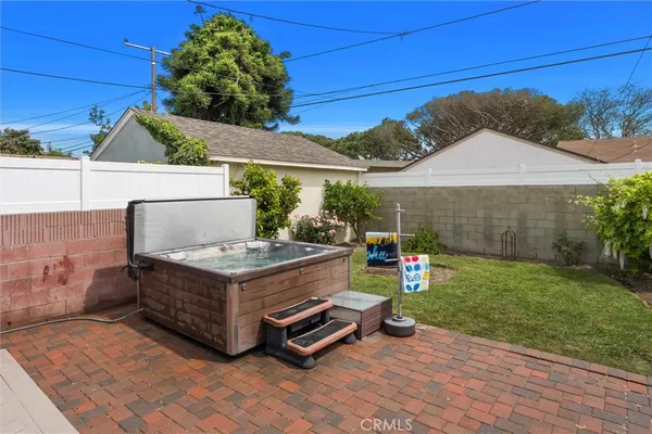 a backyard of a house with outdoor seating