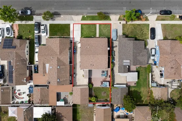 an aerial view of houses with outdoor space