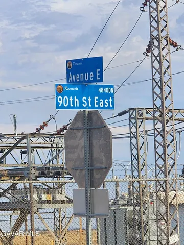 a view of a chairs and table in a patio