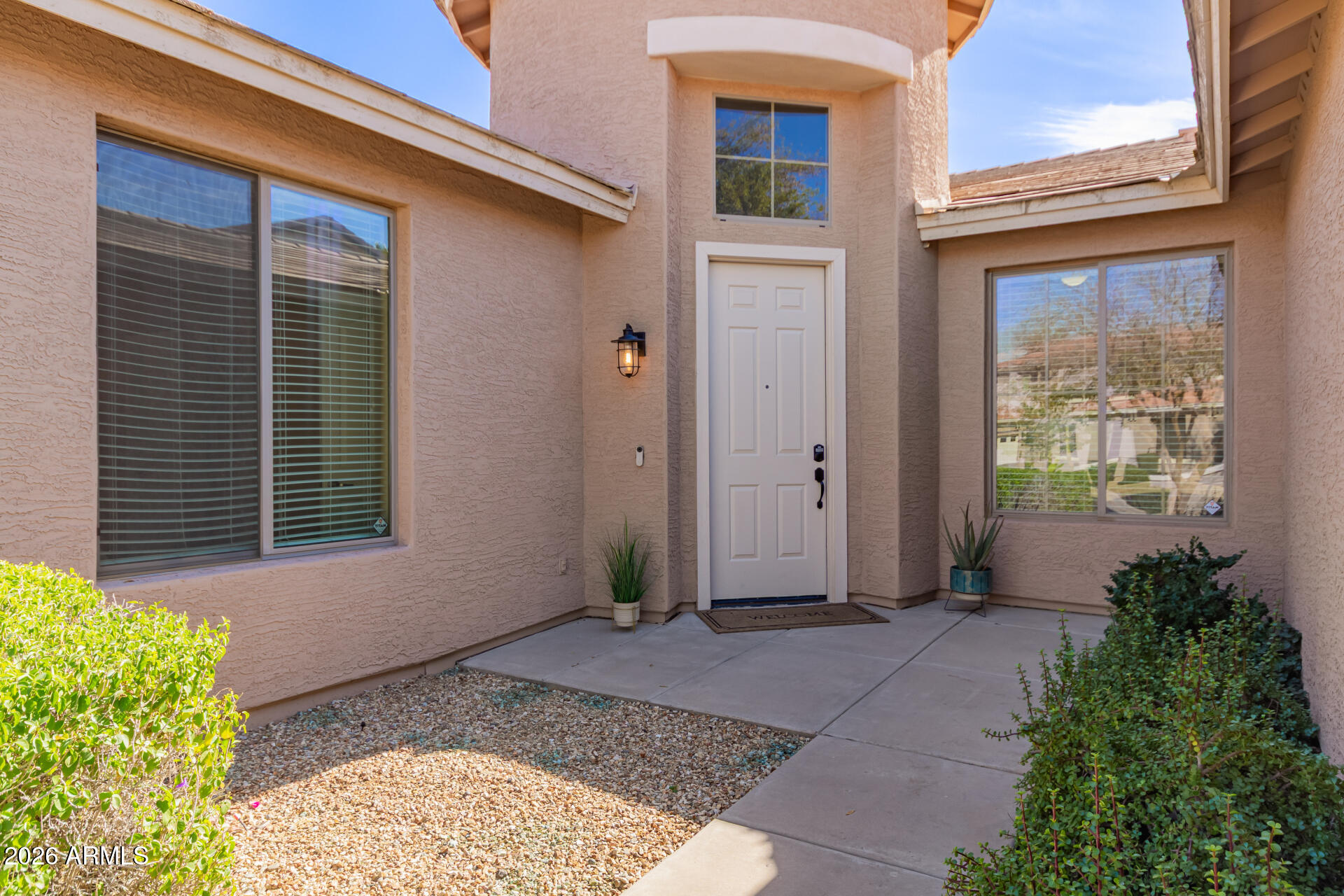 2115 West Branham Lane Phoenix, AZ 85041 - Photo 11 of 35 a front view of a house with a yard